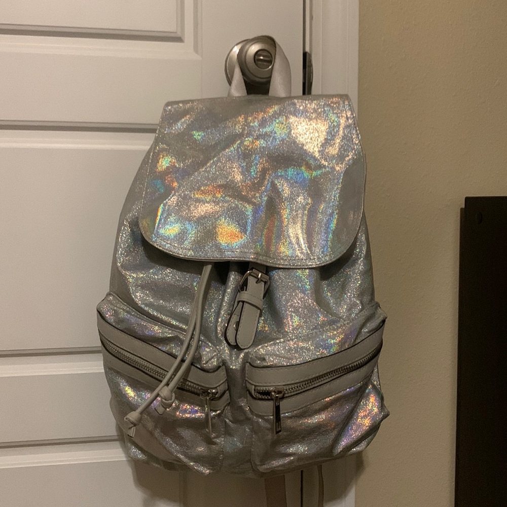 Iridescent, aluminum, silver backpack. Ready for a concert/coechella